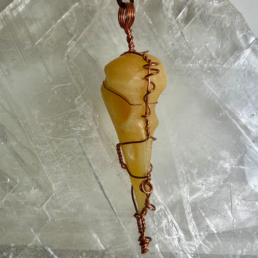 Lee's Makes - Orange Calcite Raven Head Pendant