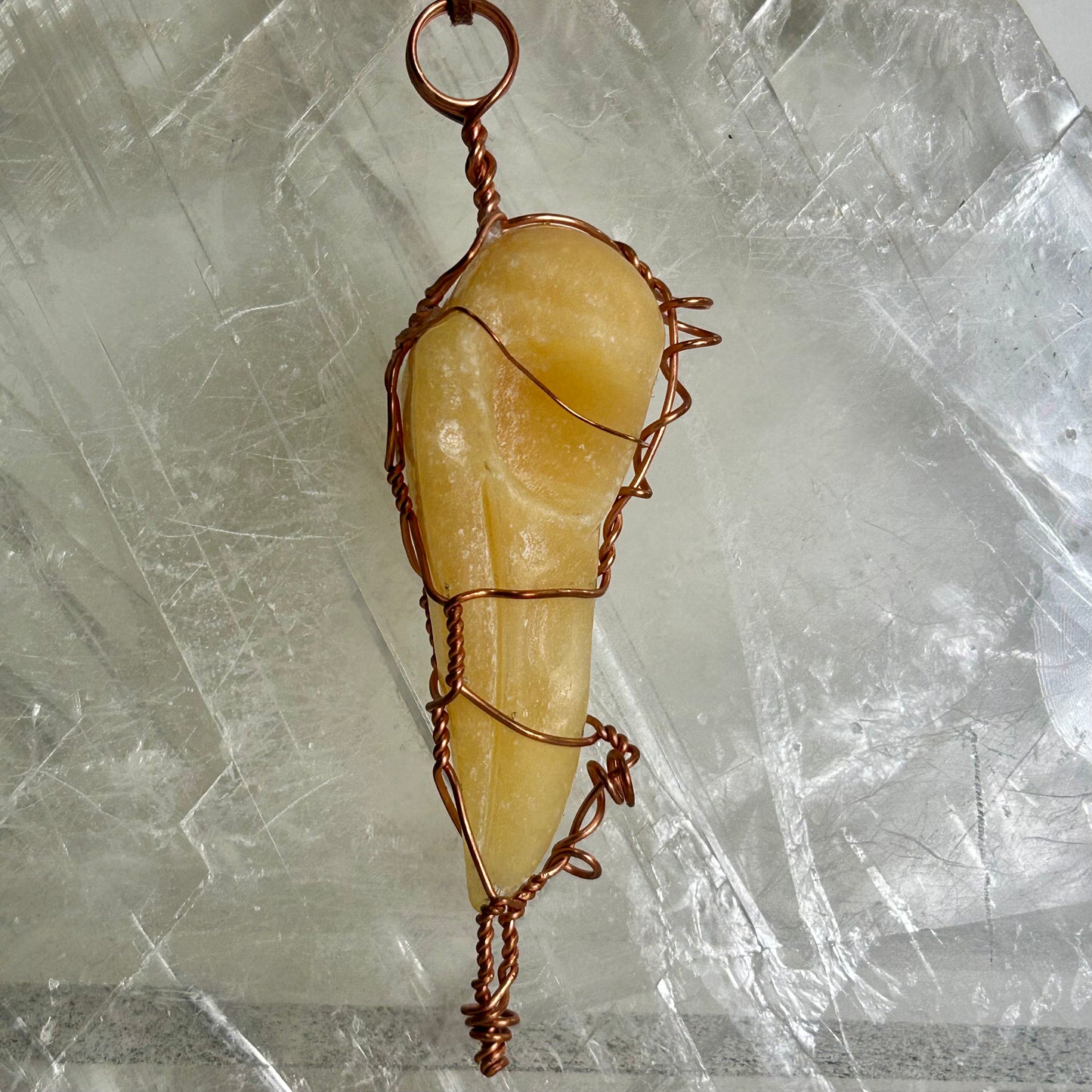 Lee's Makes - Orange Calcite Raven Head Pendant