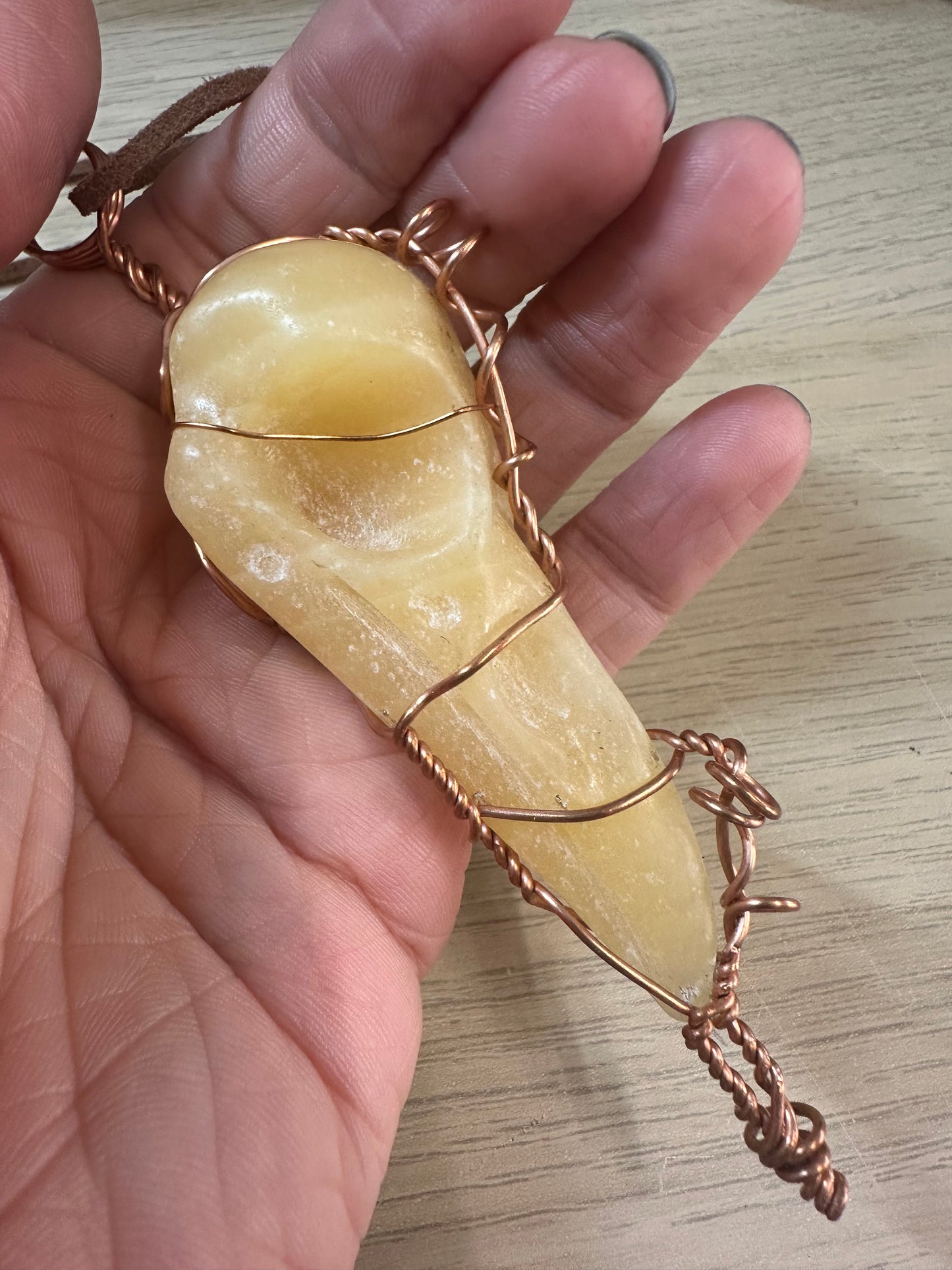 Lee's Makes - Orange Calcite Raven Head Pendant