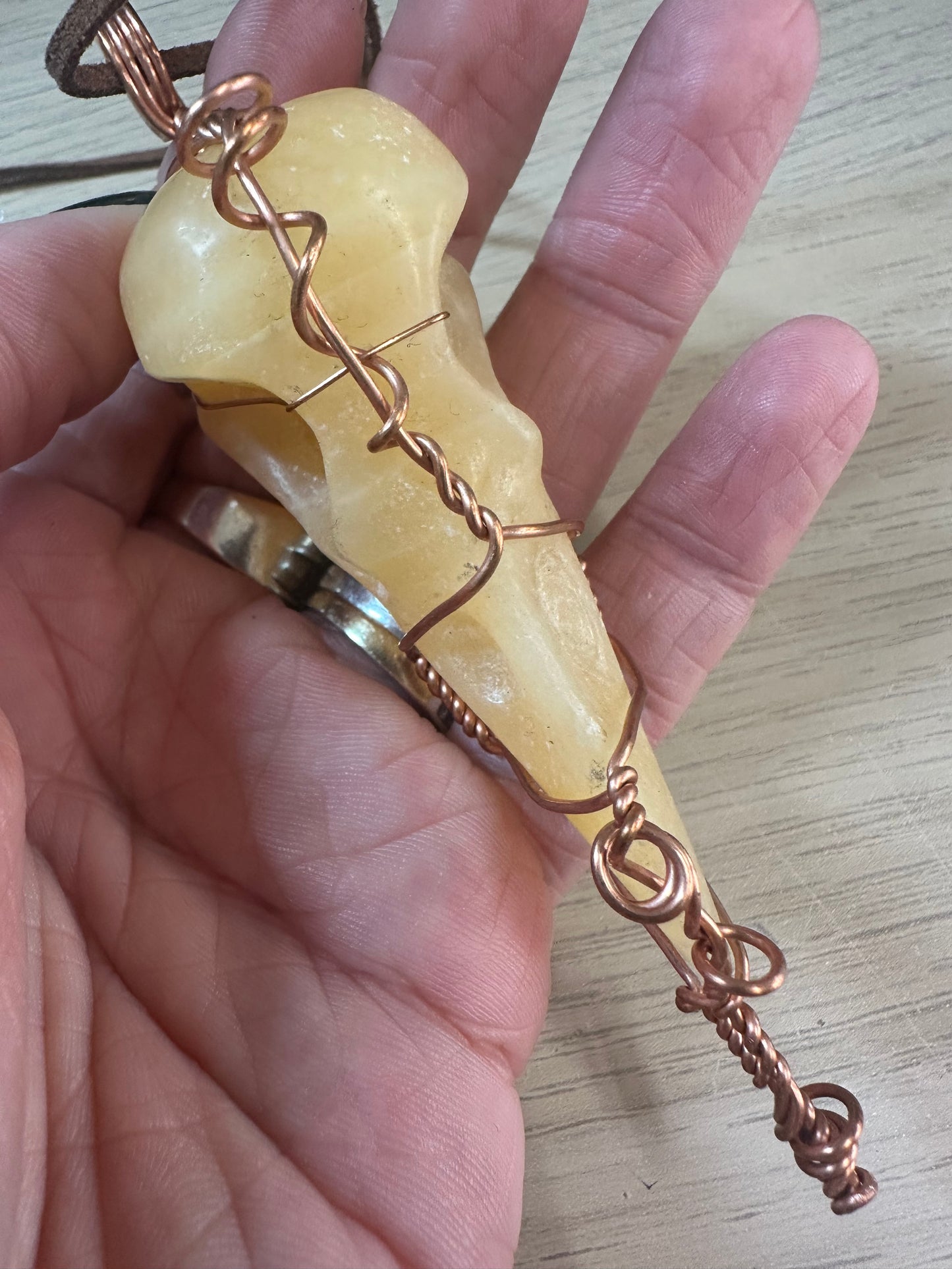 Lee's Makes - Orange Calcite Raven Head Pendant