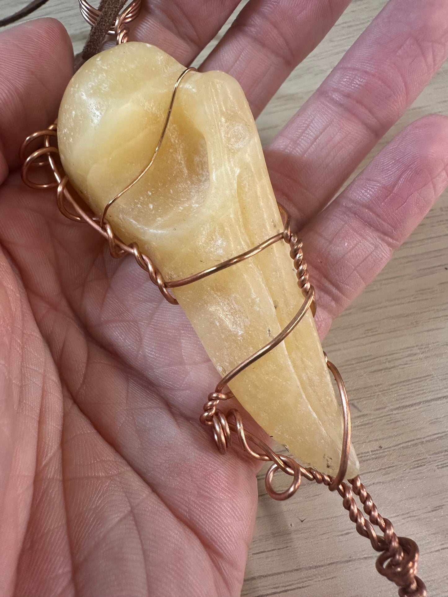 Lee's Makes - Orange Calcite Raven Head Pendant